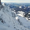 Verschneite Felswand mit Tiefblick ins Tal, Alpstein