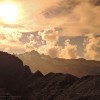 Sonne und Wolken über Bergsilhouetten, Alpstein