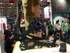 Snowboardbindungen an einem Holzstamm am Messestand ISPO 2016